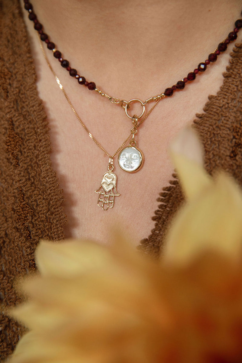 COURAGEOUS GARNET OVAL CLASP NECKLACE